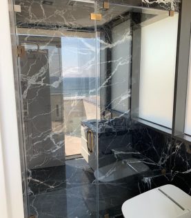 Custom Frameless Glass Shower Door by Simply Elegant